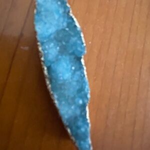 Pendant: stunning druzy the color of the sea stone set in gold. 2" x 1/2".